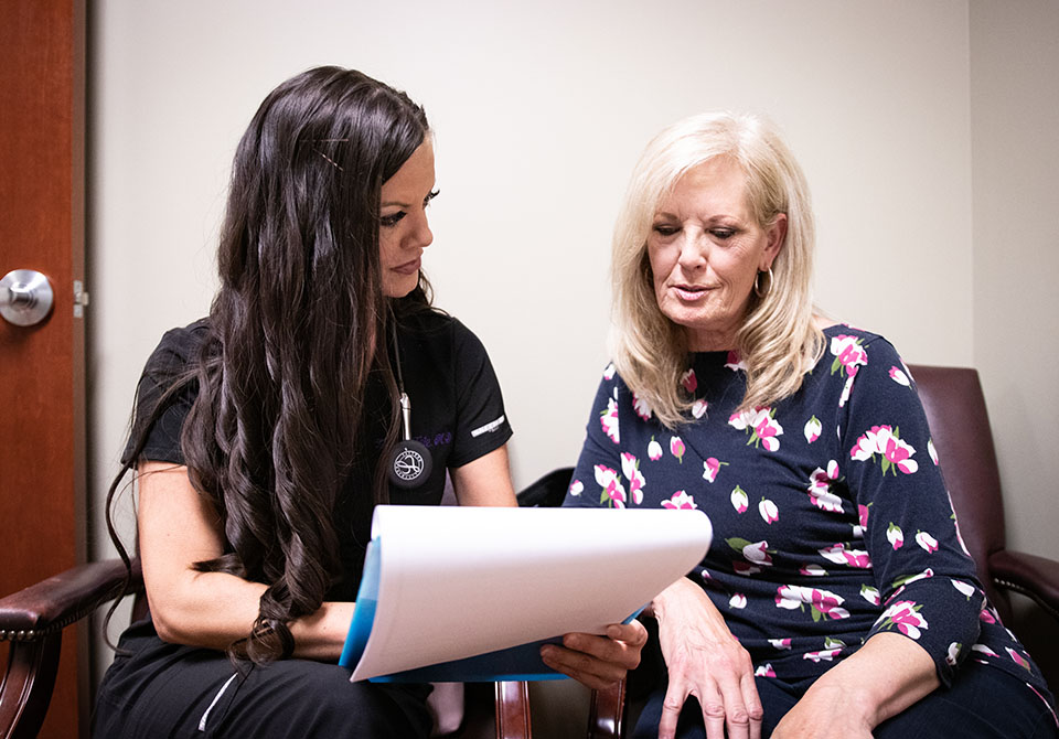 Health professional talks with patient Health professional talks with patient